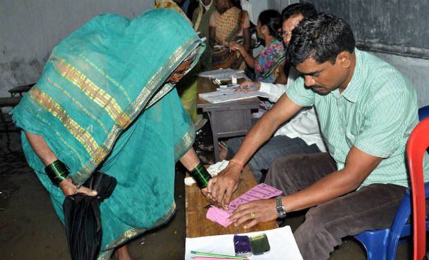 A woman casts vote at a polling station during gram panchayat elections in Adilabad district of Andhra Pradesh (Photo - PTI/File) A woman casts vote at a polling station during gram panchayat elections in Adilabad district of Andhra Pradesh (Photo - PTI/File)
